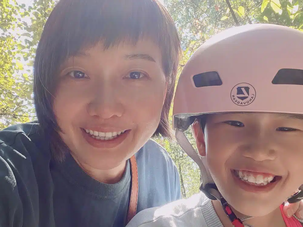Mom with daughter who is wearing a bike helmet